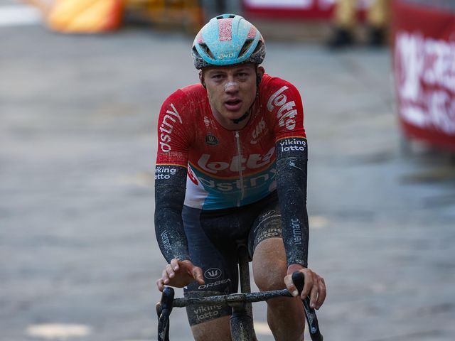 Maxim Van Gils rides to the podium at the Strade Bianche